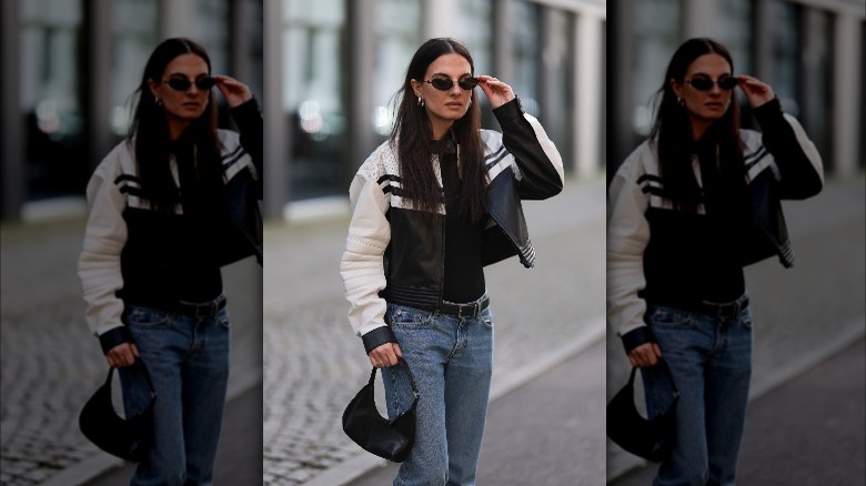 Woman wearing leather jacket and jeans 