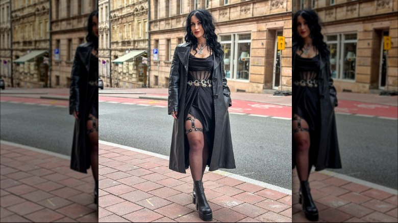 Woman models black goth outfit 