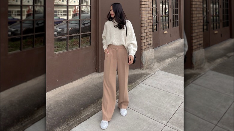 beige trousers and sweater