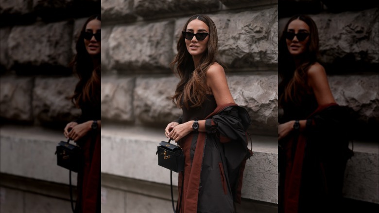 woman wearing black chunky watch