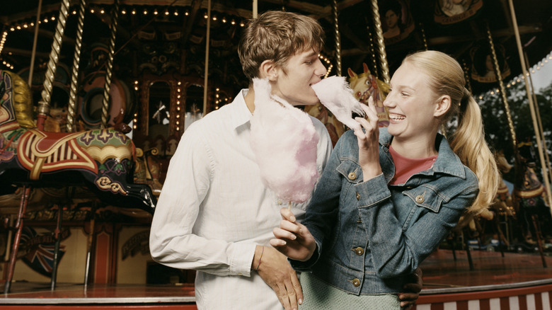 Couple eats cotton candy
