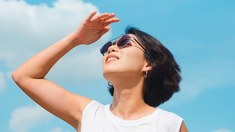 woman gazing up at sky