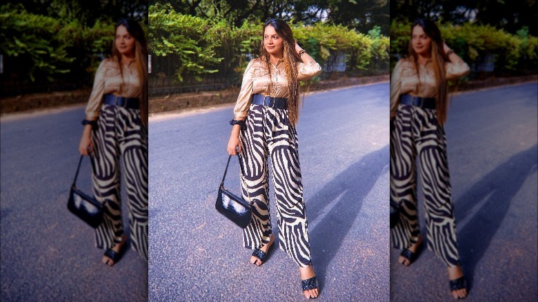 Woman posing in zebra-print pants