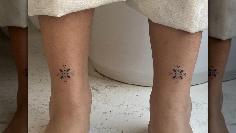 Geometric tattoo pair on ankles