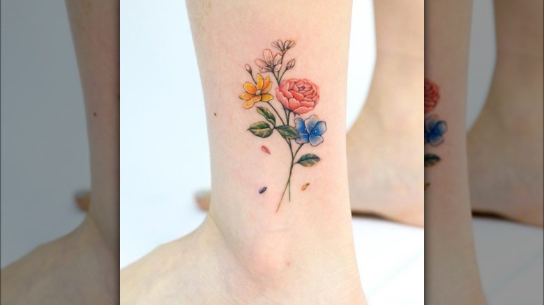 Flower bouquet tattoo on ankle