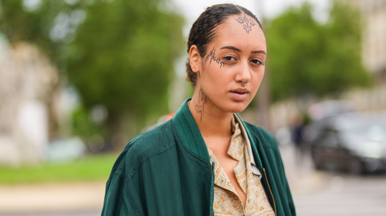 Woman with face tattoo