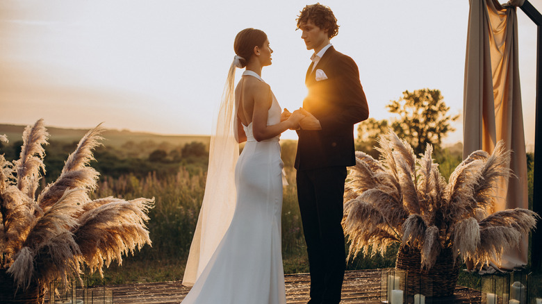 Bride and groom wedding ceremony sunset