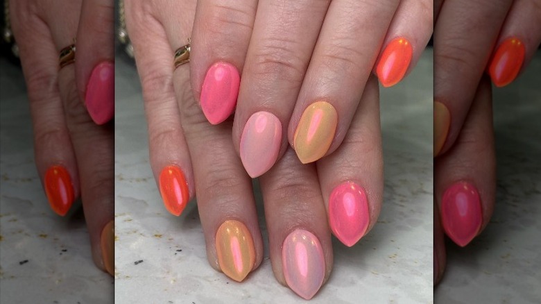 apricot gradient manicure on fingers