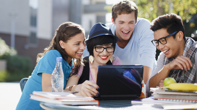 Group of friends studying outside 