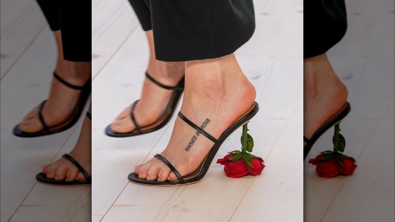 Woman wearing the Loewe rose heels.