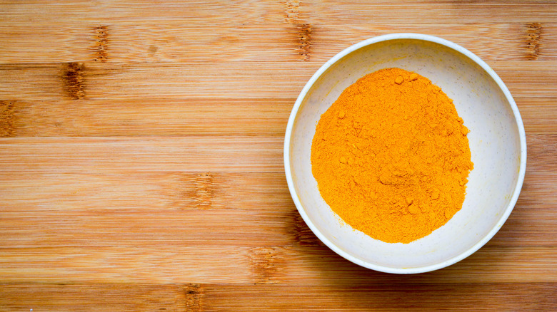 Powdered turmeric in a bowl