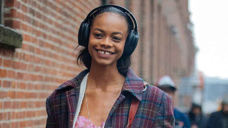model wearing jumbo headphones