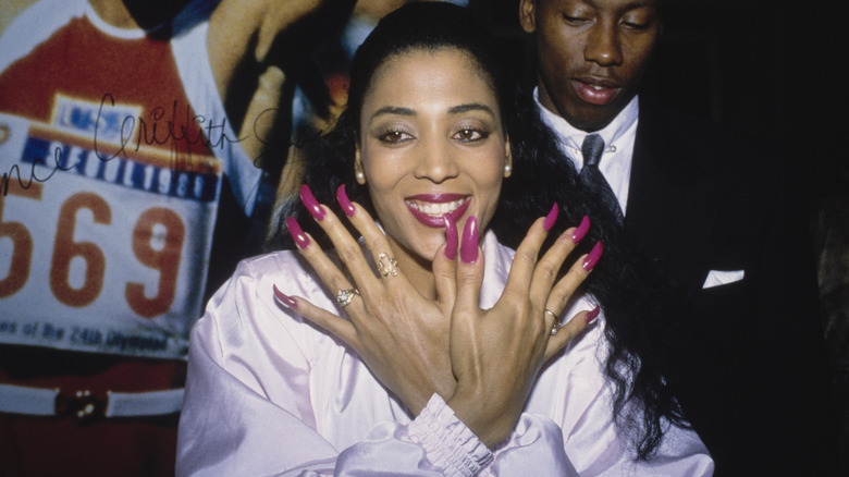 Florence Griffith Joyner holding up hands