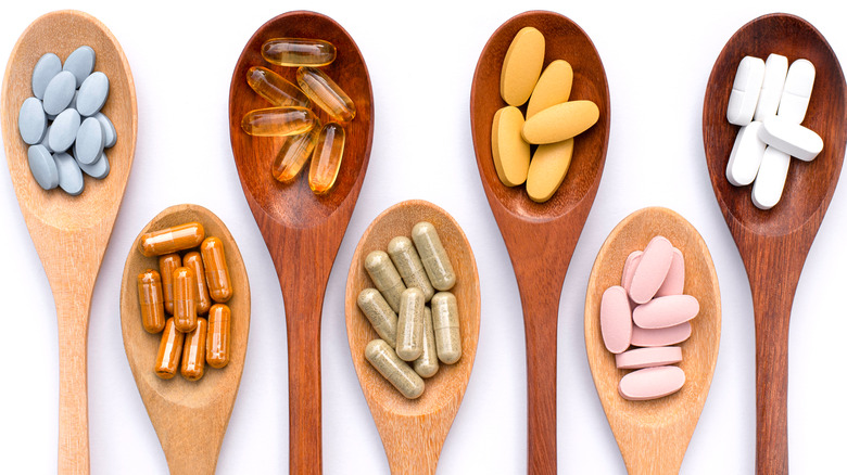 spoons with different vitamin pills