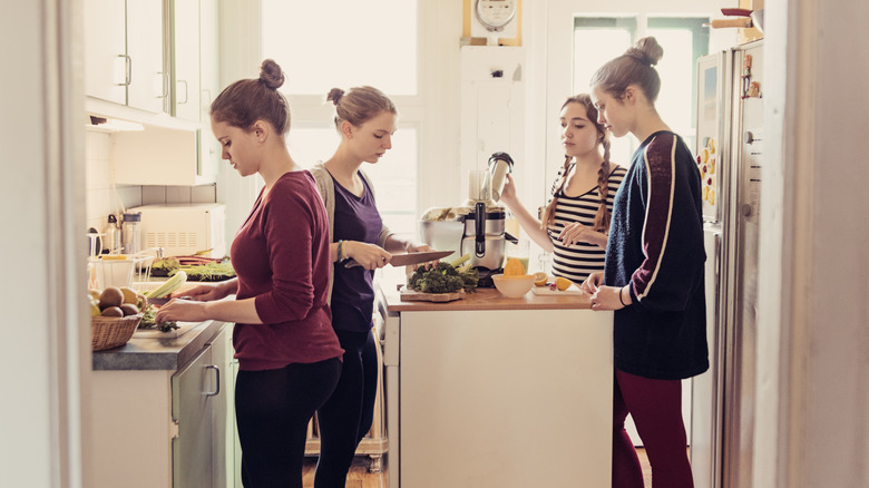 Roommates in kitchen