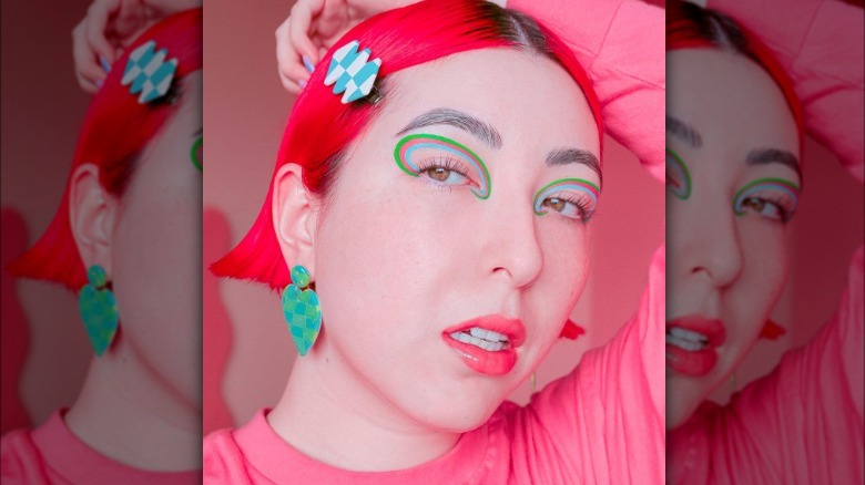 Person wearing colorful, graphic eyeliner