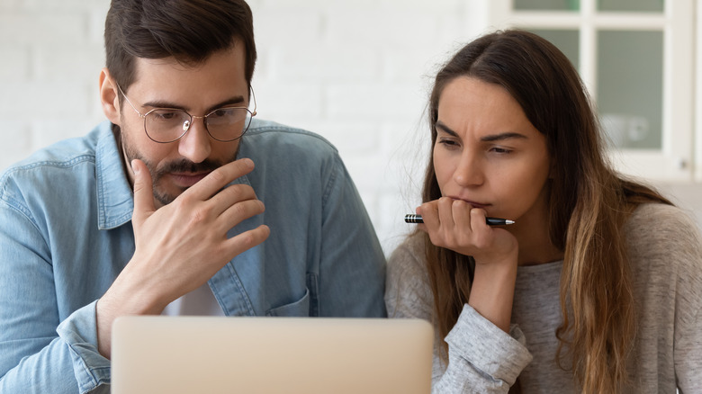 couple looking at laptop