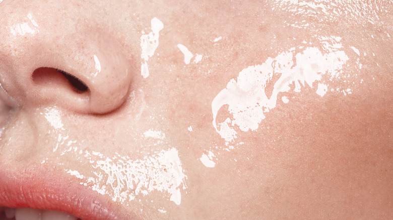 closeup of wet and glossy woman's face