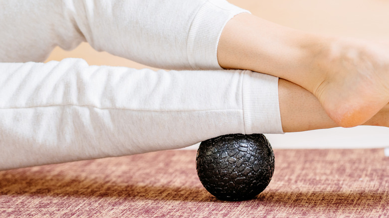 female legs on acupressure mats