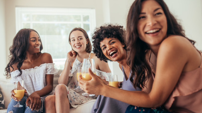 women laughing in living room