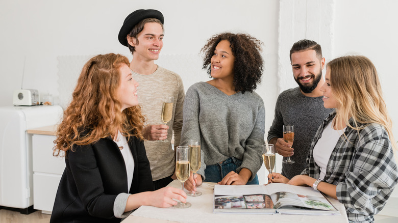 group of people looking at magazine