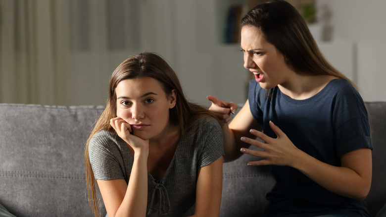 Woman scolding her friend