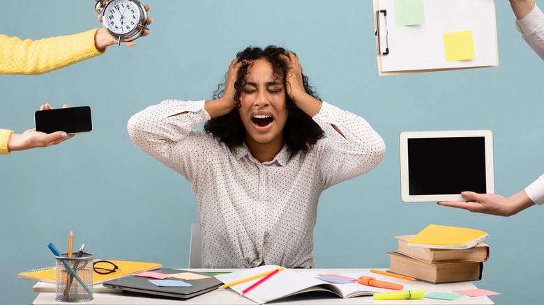 Stressed woman with too many responsibilities