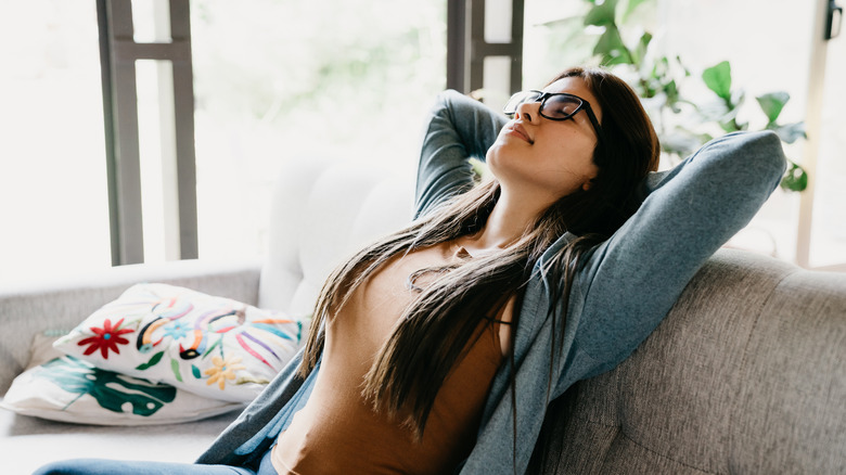 Peaceful woman on couch