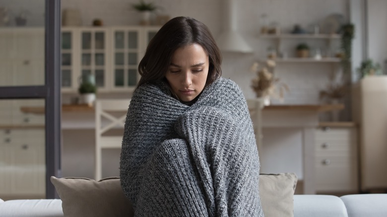 woman wrapped in blanket