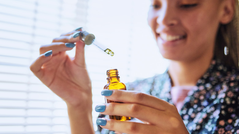 woman using argan oil