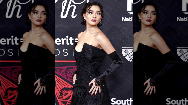 Paulina Chávez wearing a vintage black gown on the red carpet.