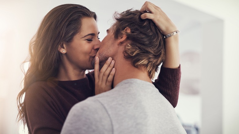 man and woman couple kissing