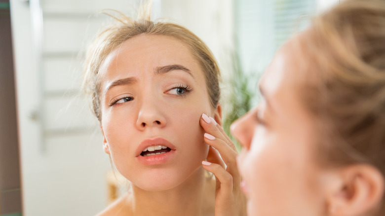 woman looking at puffy face