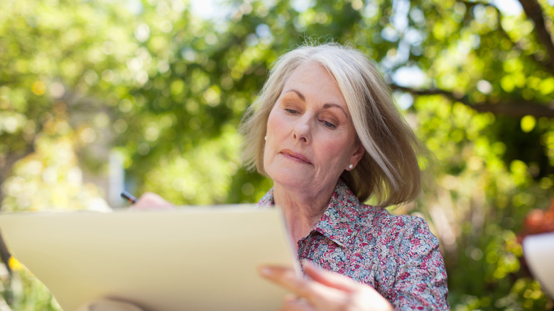 Woman drawing outside