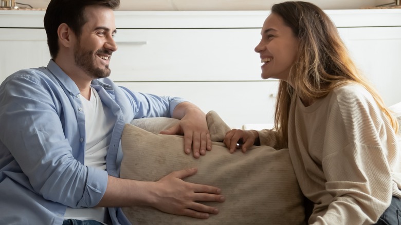 couple talking on couch