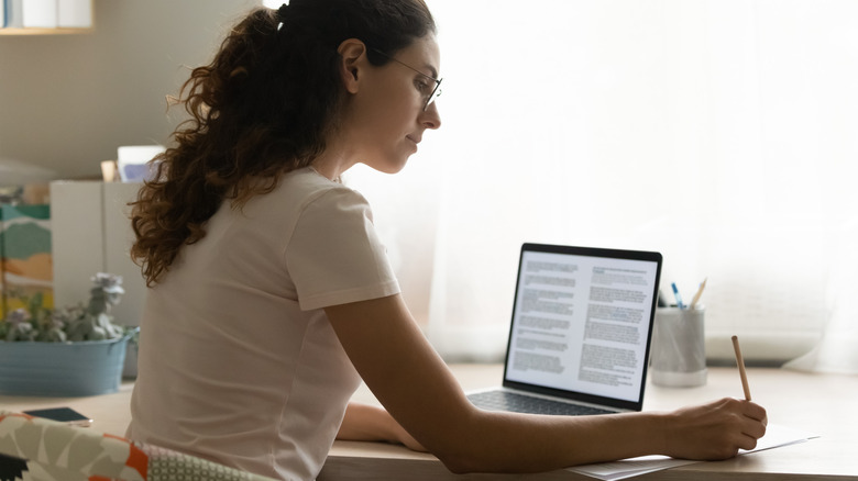 Woman writing a book