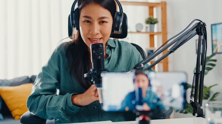 Woman speaking on a podcast