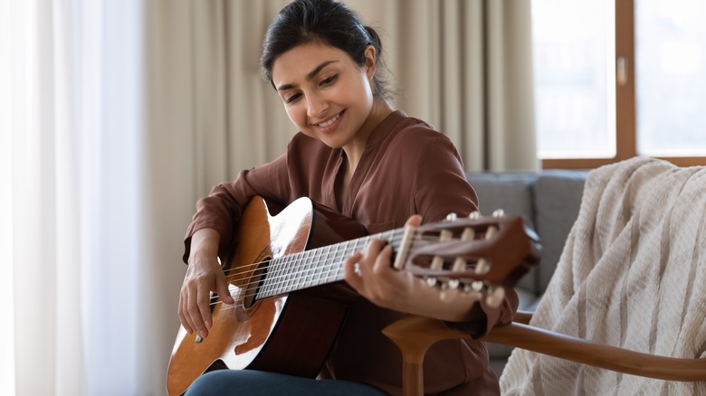 Woman playing guitar