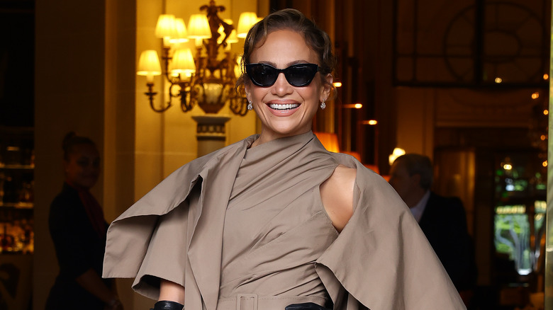 Jennifer Lopez smiling in taupe