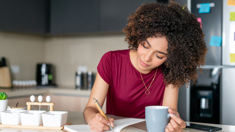 Woman writes in journal