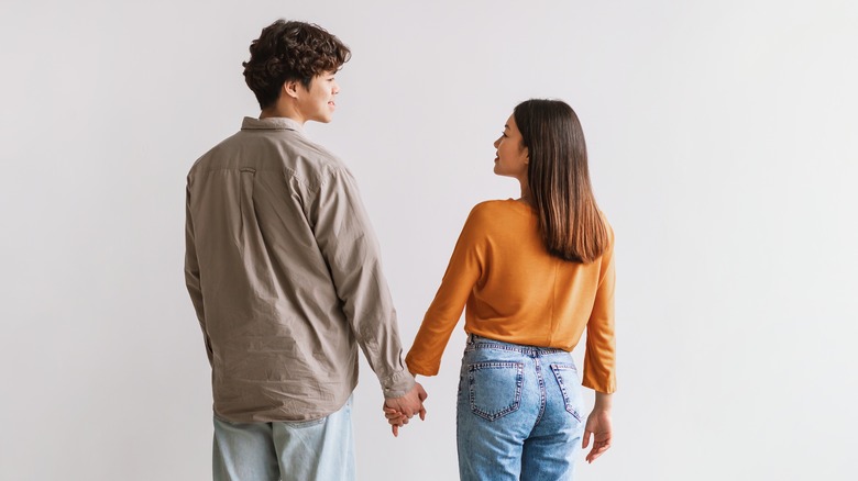 Couple holding hands