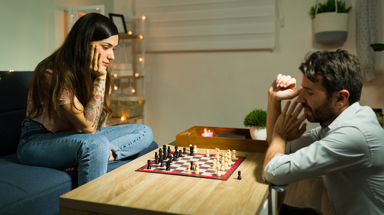 couple playing board game