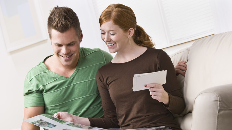 couple looking at scrapbook