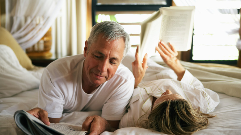 couple reading in bed 