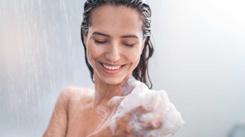 Woman showering in the sunlight