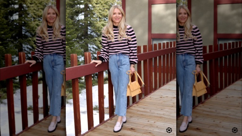 Girl wearing pink penny loafers.