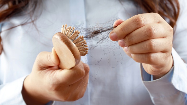 woman using hair brush