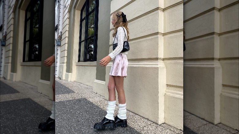 Girl wearing leg warmers on street