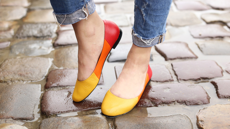 Woman wearing color-blocked flats