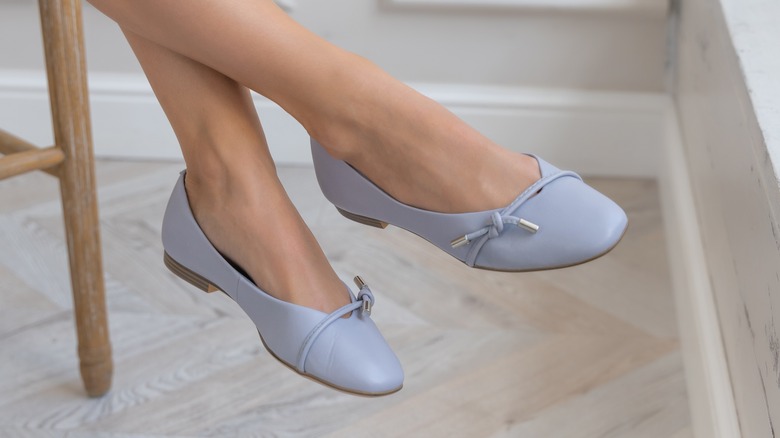 Woman wearing pastel ballet flats